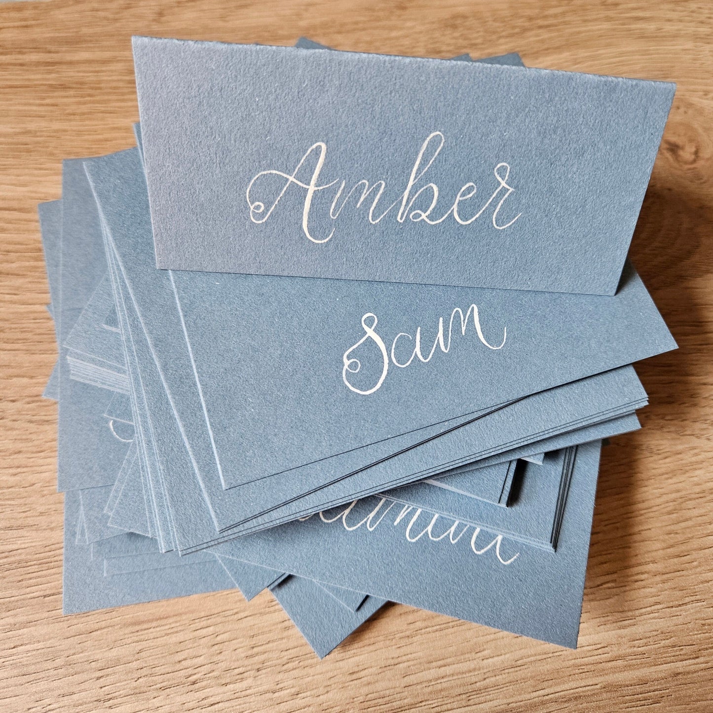 Dusty Blue Wedding Place Names | Blue Tented Place Names | White Ink Wedding Place Cards | Handwritten Calligraphy